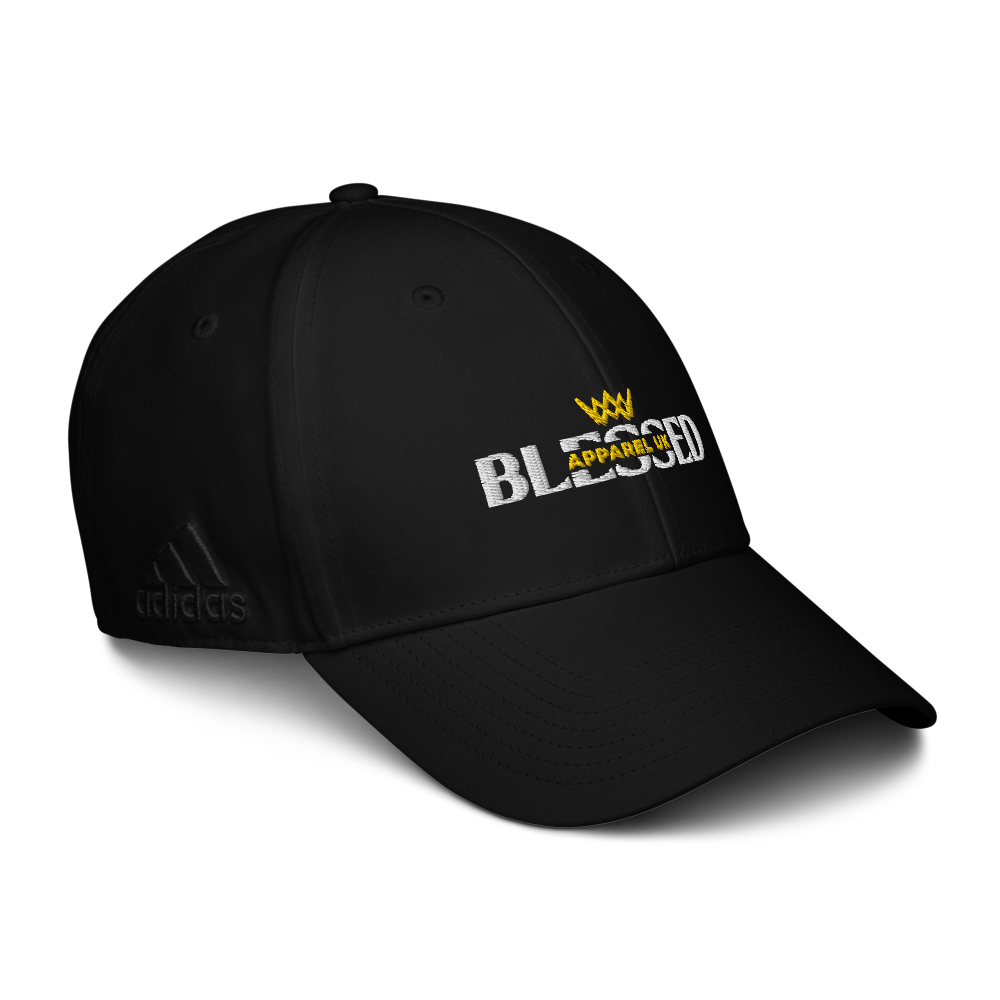 Close up image of a black baseball cap with blessed apparel and Adidas logos in yellow, white and black.