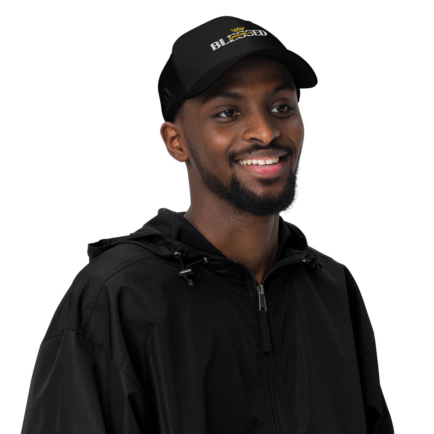 Image of a smiling person wearing a baseball cap with blessed apparel logo in yellow and white.