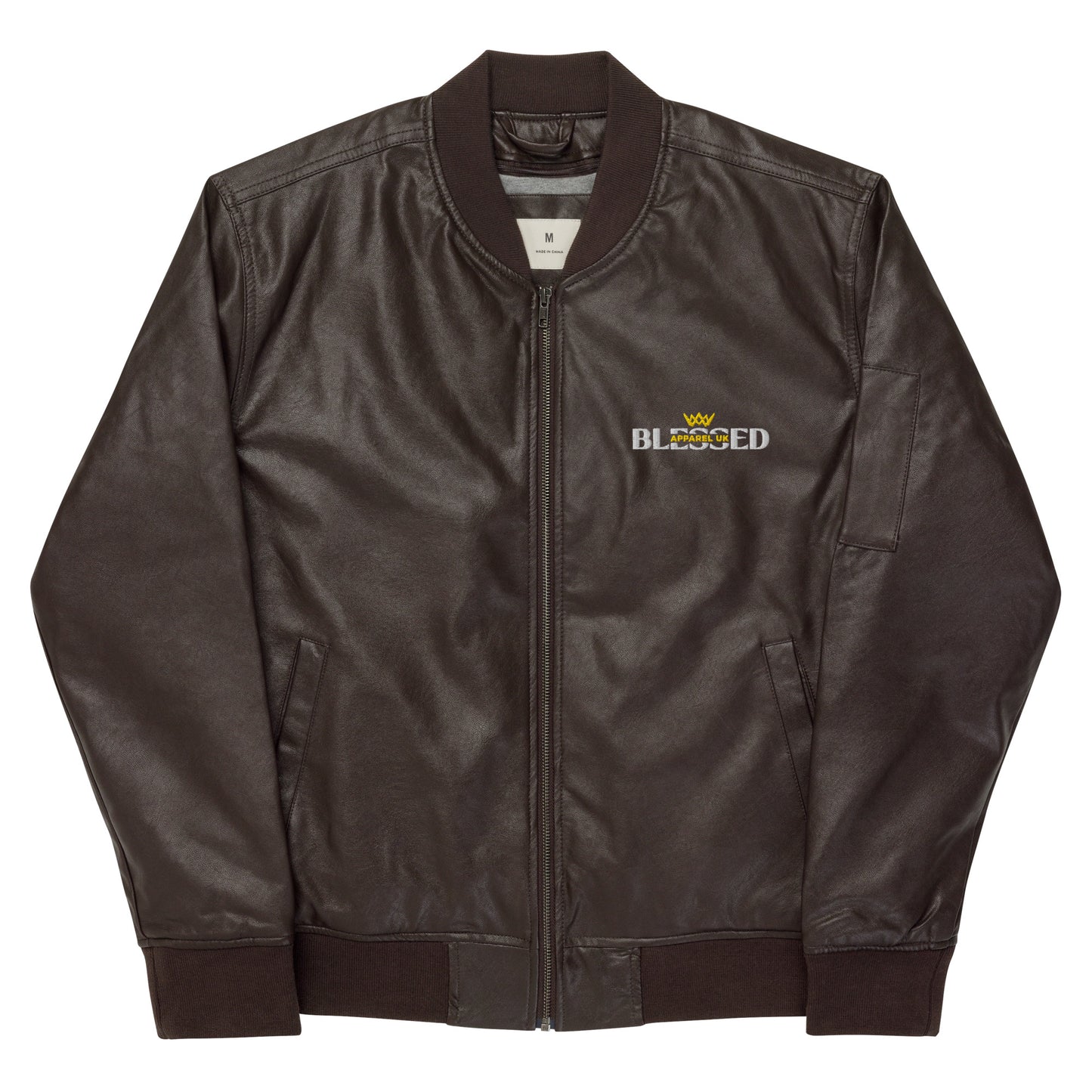 Image of a brown jacket with blessed apparel logo in yellow and white.