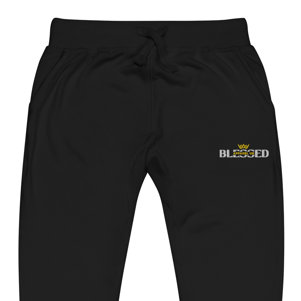 Flat lay image of black sweatpants with blessed apparel logo in yellow and white.