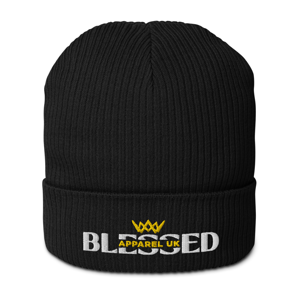 Close up image of a black beenie hat with blessed apparel logo in yellow and white.