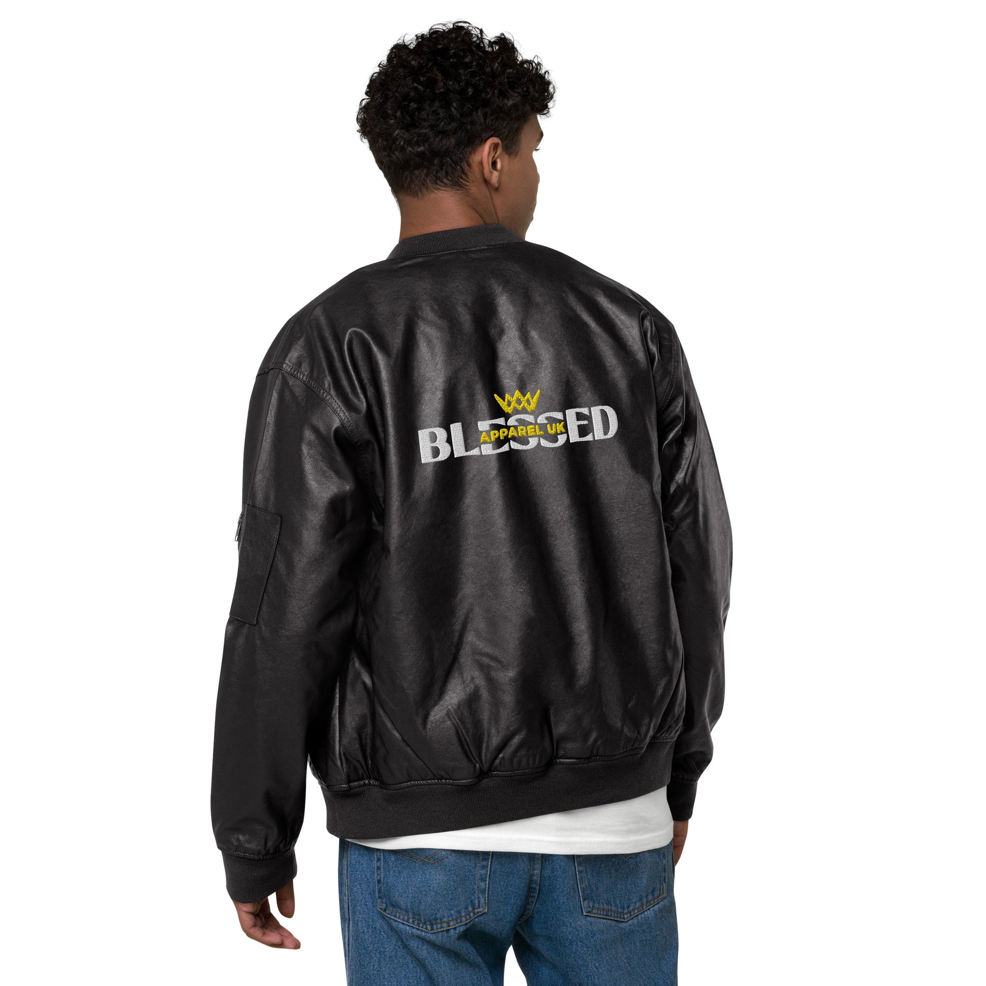 Image of a person standing with their back to the camera, wearing a black jacket with blessed apparel logo in yellow and white.