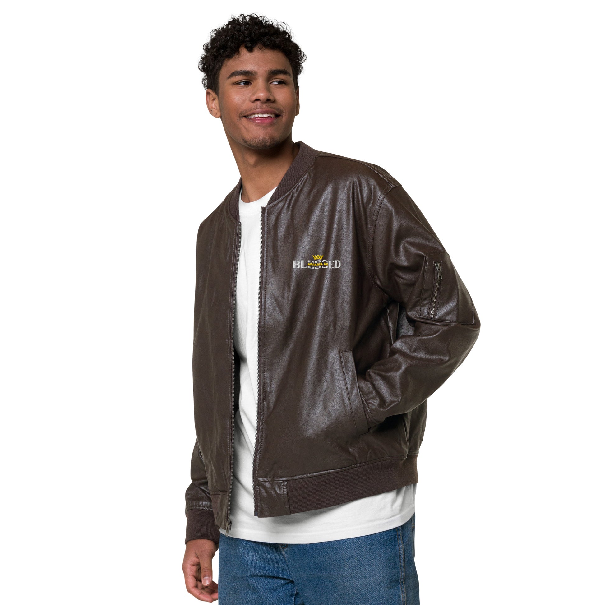 Image of a smiling person wearing a brown jacket with  blessed apparel logo in yellow and white.