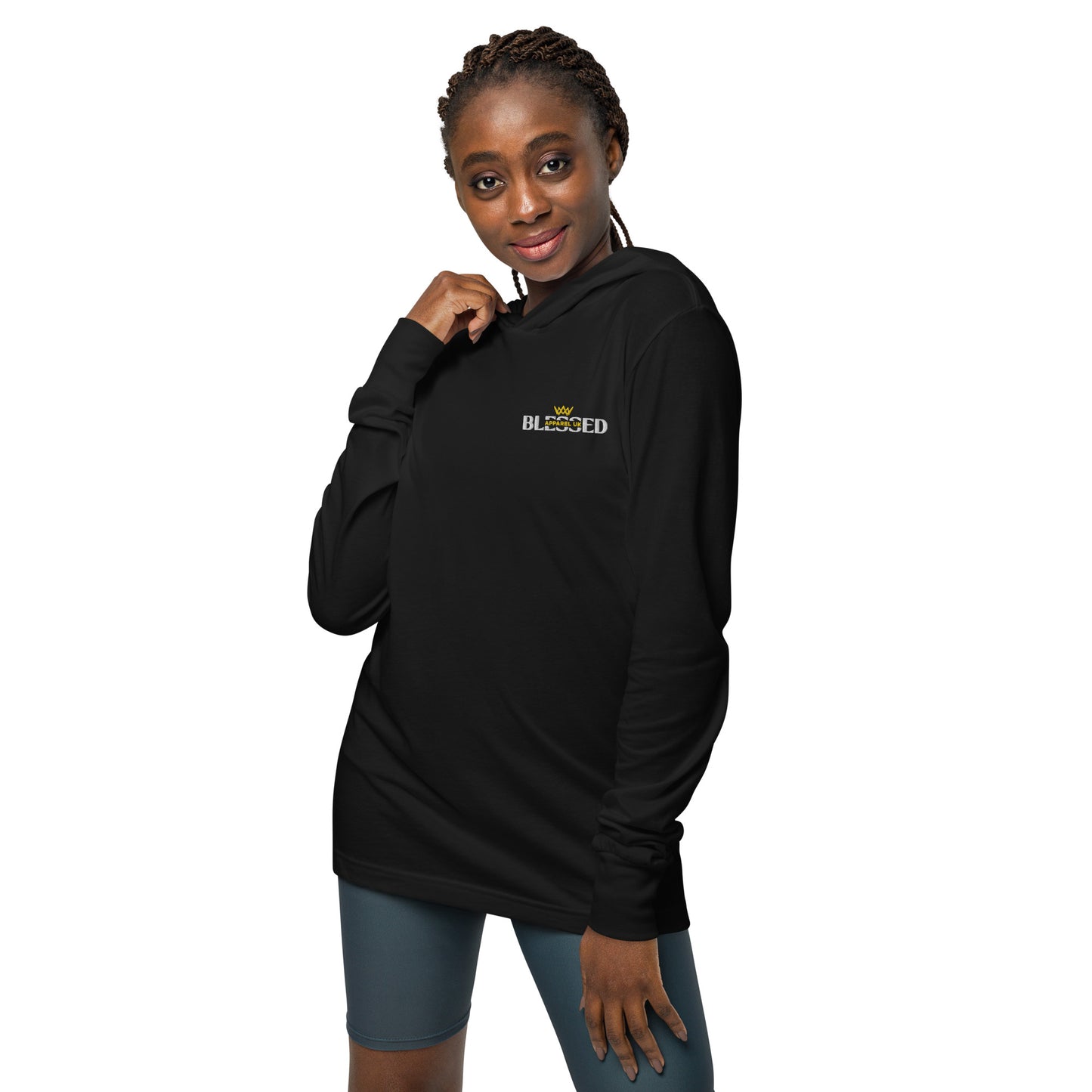 Image of a person wearing a black hooded long sleeve t-shirt with blessed apparel logo in yellow and white.