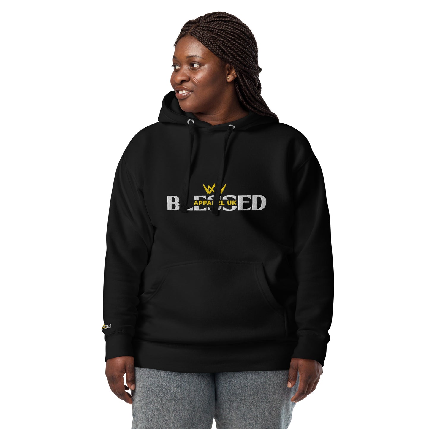 Image of a smiling person wearing a black hoodie with blessed apparel logo in yellow and white.