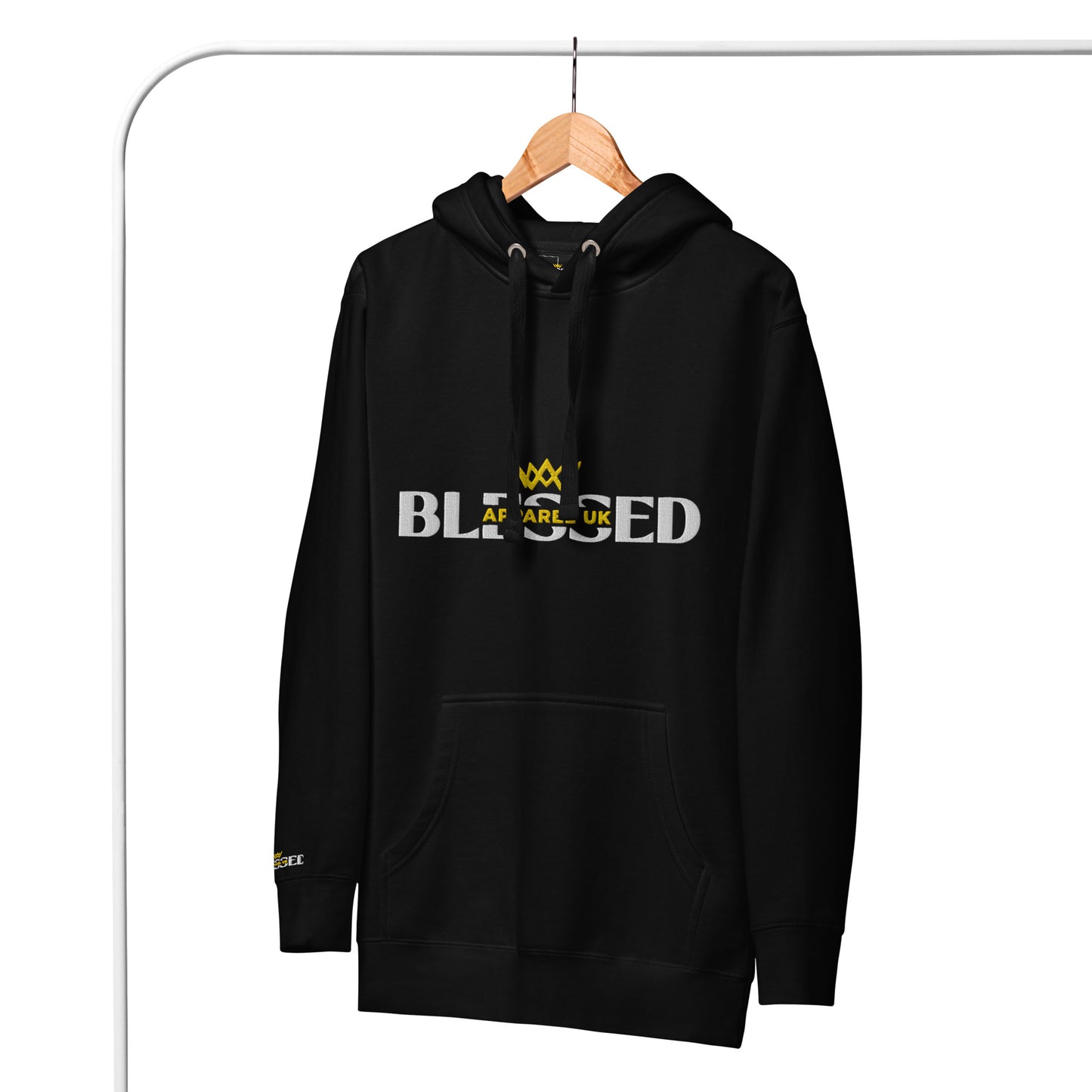 Image of a black hoodie hanging on a rail, with blessed apparel logo in yellow and white.