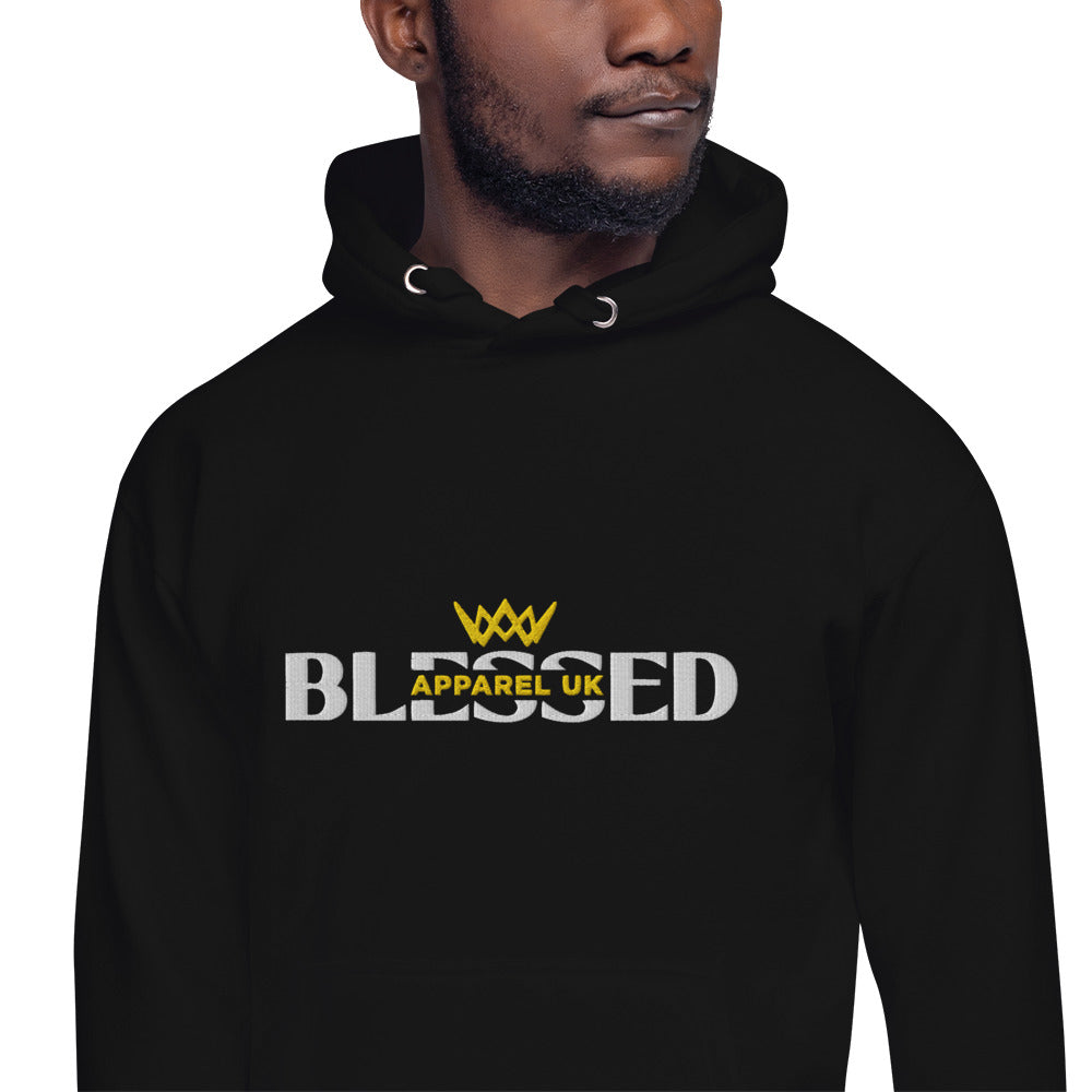 Close up image of a person wearing a black hoodie with blessed apparel logo in yellow and white.