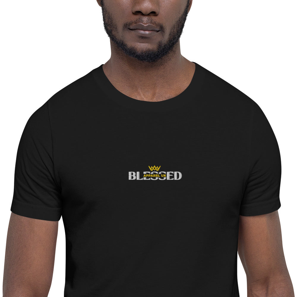 Image of a person wearing a black short sleeve t-shirt with blessed apparel logo in yellow and white.